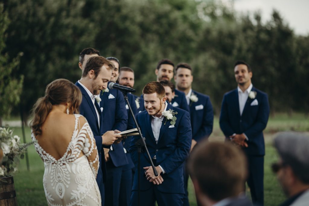 Groom makes bride laugh during ceremony