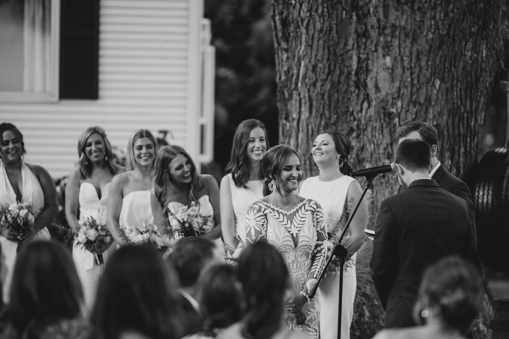 Bride laughs at groom during ceremony