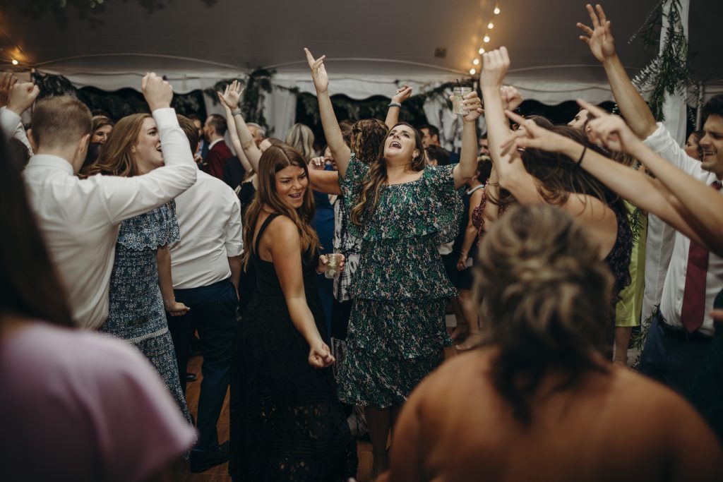 Super fun wedding dance floor under a tent.