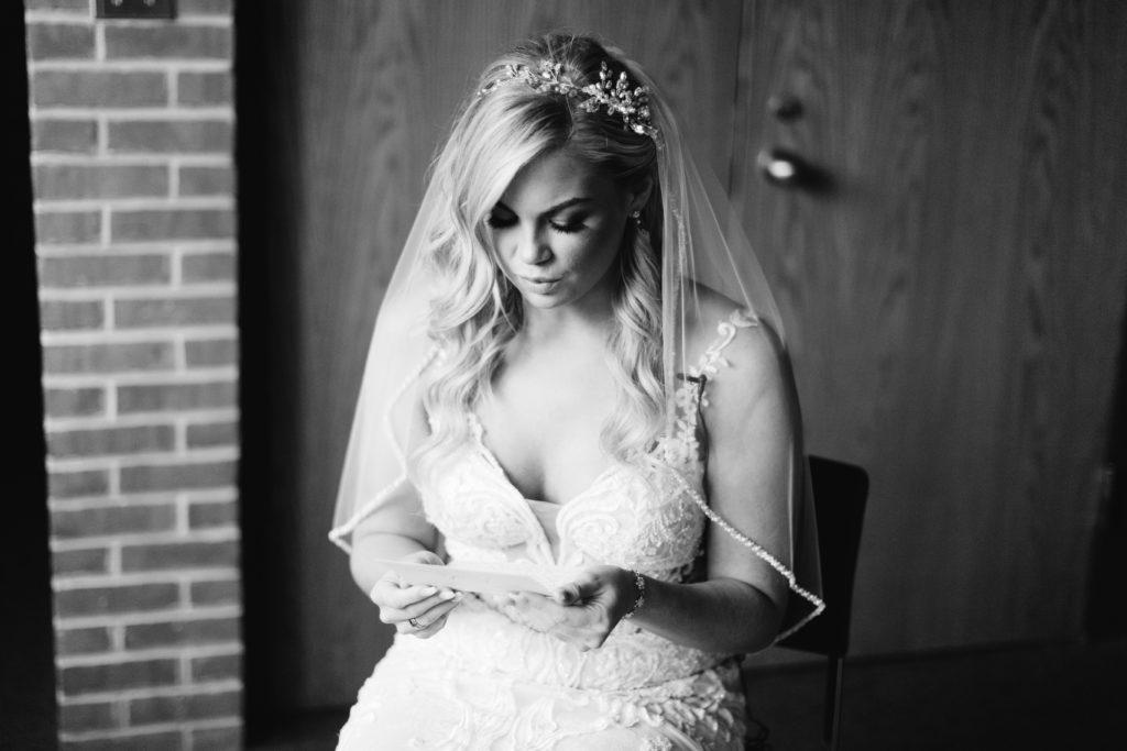 Bride cries as she reads emotional letter from groom.