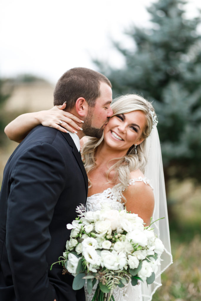 High school sweethearts finally marry on their farm for a rustic wedding.