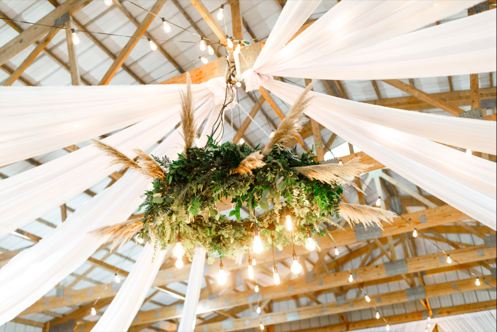 Centerpiece floral chandelier at DIY barn, rustic wedding.