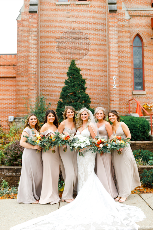 Bridesmaid goals with bridesmaids in gray dresses.